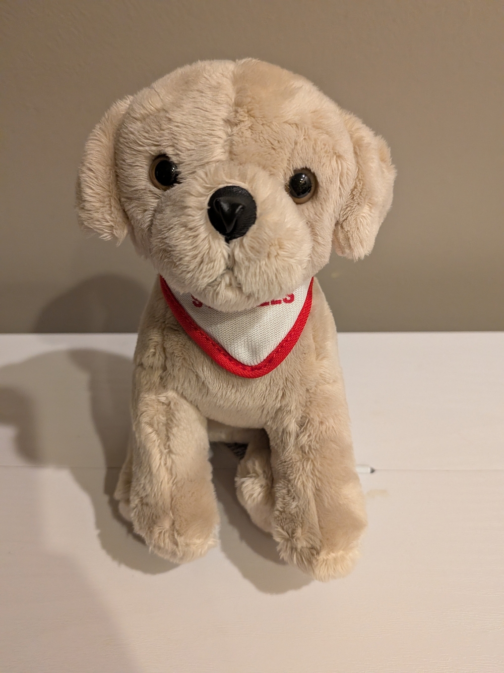 Plush Beige Dog Toy with Red-Trim Bandana